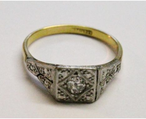 Diamond solitaire ring with brilliant in a square setting, '18ct pla'. Condition Report Good condition.
