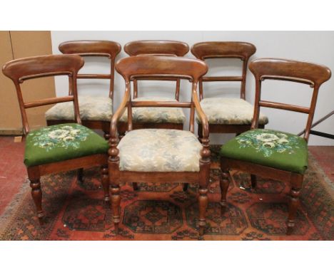 Set of six mahogany dining chairs with scrolling top rail and drop-in seats, including a matching carver armchair.