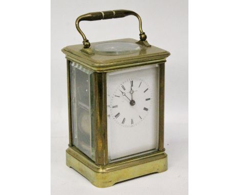 Early 20th century French brass carriage clock, makers Howell &amp; James of Paris, with Roman enamel dial, the compensated l