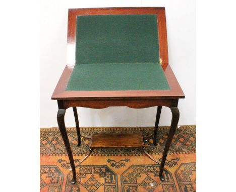 Edwardian mahogany card table on cabriole legs, 74cm high.