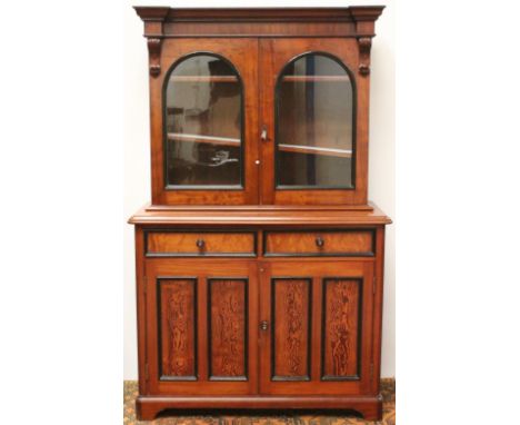 Victorian mahogany bookcase with two arched, glazed doors over two drawers and cupboards, on bracket feet, 202cm high and 125