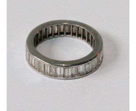 Diamond eternity ring with baguettes of varying widths, in white gold. Condition Report Internal diameter 18.5mm
