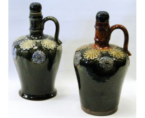 Two near-matching Royal Doulton stoneware spirit jugs, possibly by Maud Bowden, slight colour variations, blueish-green bodie