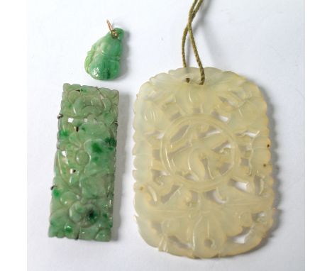 Jadeite carved panel brooch in silver, a similar small pendant and a rectangular pendant in pale hardstone. (3)