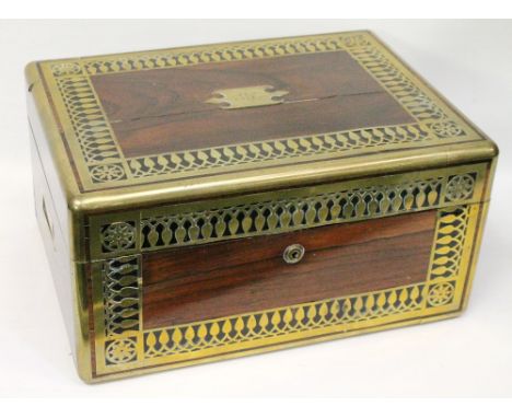 Victorian brass inlaid rosewood toilet box, the interior fitted with glass jars and manicure tools, the lock marked 'Batley L