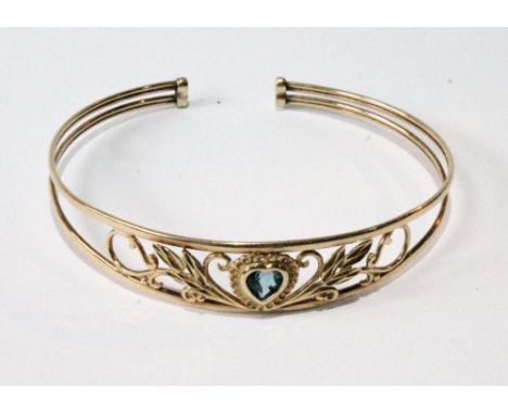 Gold sprung bangle with blue spinel in the manner of Sybil Dunlop.