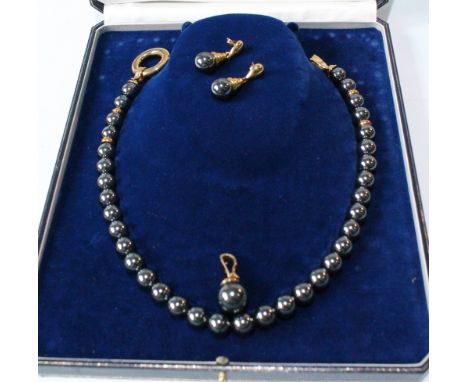 9ct gold and haematite bead necklace with ring and hook closure, with matching pendant and earrings.