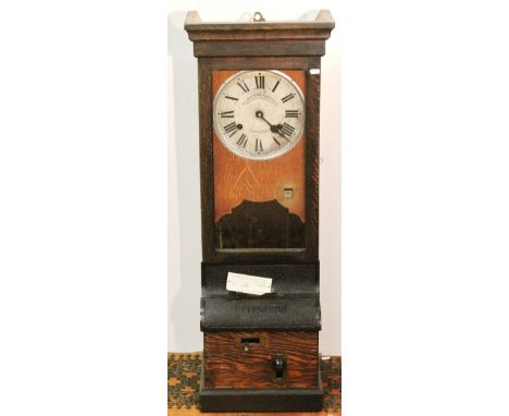 National Time Recorder Company oak clock with Roman enamel dial above a calendar aperture and base with iron mounts, 109cm hi