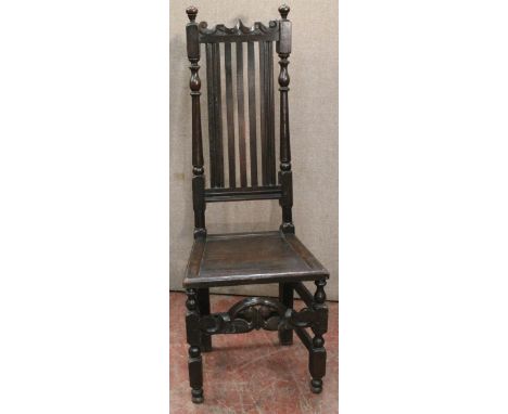 Late 17th century oak side chair with serpentine crest and straight rail back, solid panel seat, on turned block legs, 125cm 