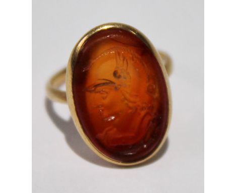 18th century gold signet ring with oval intaglio carnelian carved with a classical head after the antique. Condition Report F