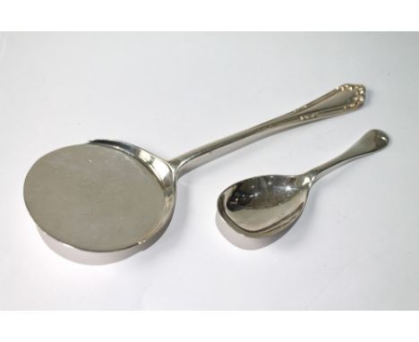 Silver pie slice, 1928, and a silver caddy spoon, 1918.