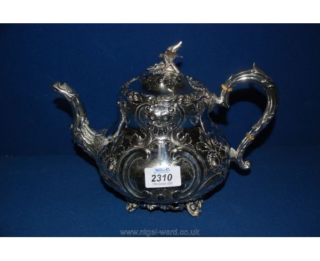 An ornate plated Teapot with eagle spout and finial, marked 473 to base