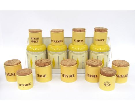 Four Worcester ware storage cans on shelf, Made in England, 1950's and eleven ceramic spice pots by Kilncraft, Made in Englan