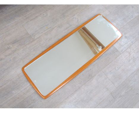 A vintage 1960's teak wall mirror, Overall size 95cm x 36cm 