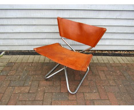 A 'Z-Down' chair designed by Erik Magnussen for Torben Orskov &amp; Co in tubular chrome and tan leather.  (Pitted chrome all