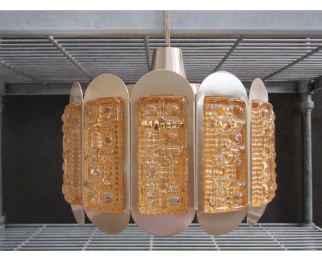 A brassed metal ceiling light with amber coloured moulded glass panels. 25cm diameter x 22cm high 