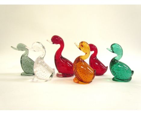 A Whitefriars large Dilly Duck in Ruby and five smaller examples in Ruby, Amber, Flint, Green etc. 13cm - 16cm high (6) 