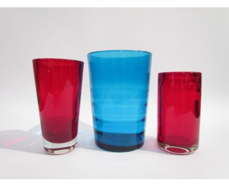 Three Whitefriars optic vases designed by Geoffrey Baxter, No.9586, 9583 and a bucket form in Ruby and Kingfisher Blue. Talle