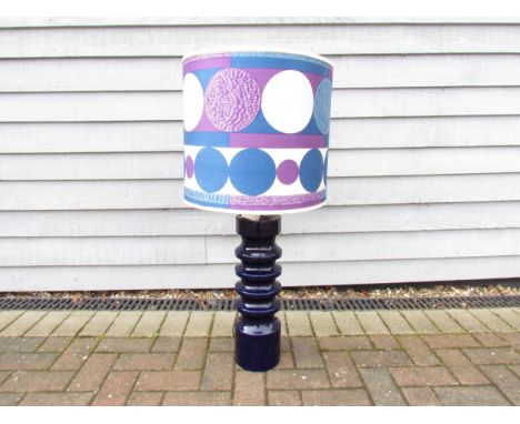 A Doulton ceramic cylindrical table lamp with deep blue glaze, op art fabric shade. 95cm high including shade, base 50cm with