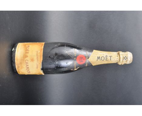 Bottle of Moet &amp; Chandon vintage Champagne. Seal appears unopened.