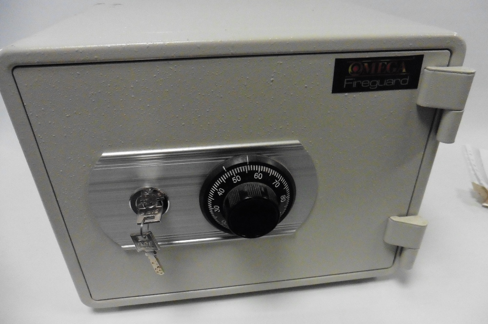 An Omega Fireguard 160 Key and Combination safe, with instructions