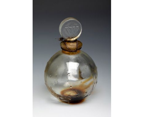 RENÉ LALIQUE (Ay, France, 1860- Paris, 1945).Bottle for Worth "Dans la Nuit", ca. 1940.Moulded glass.Work reproduced in "Le C