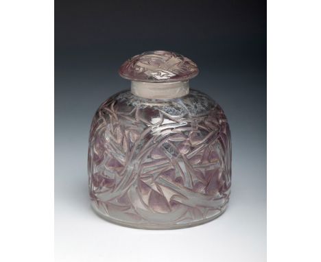 RENÉ LALIQUE (Ay, France, 1860- Paris, 1945).Perfumery box "Epines, flacon no. 3", ca. 1930.Moulded glass.No signature.Work r