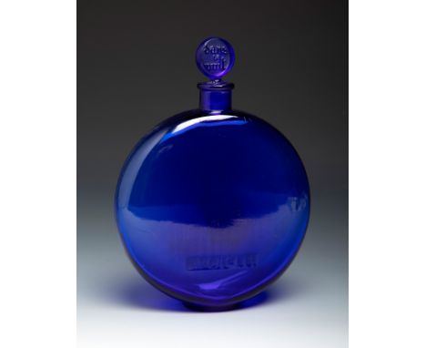 RENÉ LALIQUE (Ay, France, 1860- Paris, 1945).Bottle for Worth "Dans la Nuit".Blue moulded glass.Signed on the back of the bas