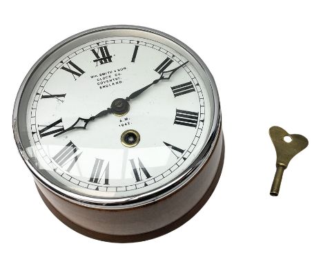 Wm. Smith &amp; Son mahogany cased bulk head clock with chrome bezel, the enamel dial with Roman numerals marked A.M. 1942 D1