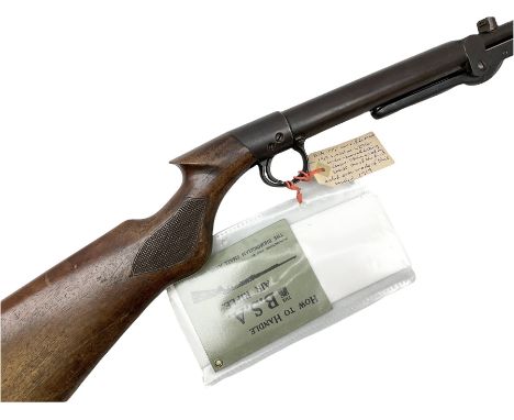 Early 20th century BSA .177 air rifle with under barrel lever cocking action, walnut stock with chequered pistol grip and sid