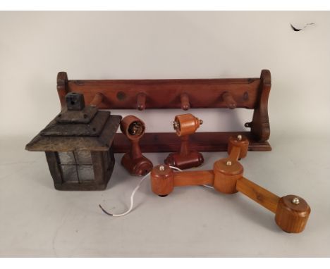A mixed lot to include a wooden coat rack, a light fitting and a carved wooden chess set in a box