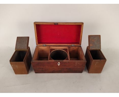 A Regency burr yew sarcophagus shaped tea caddy with boxwood stringing and fitted interior