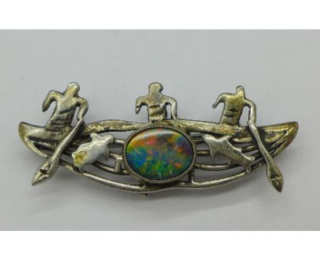 A silver and doublet opal brooch depicting three South Sea fishermen