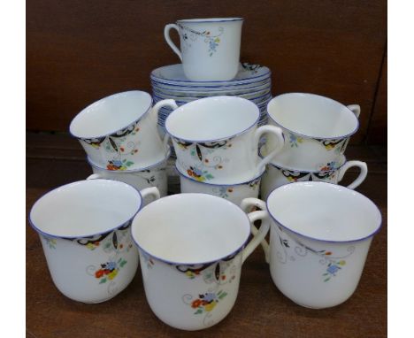 Shelley teaware comprising ten cups (five cracked), eleven saucers (3) and ten side plates (2)
