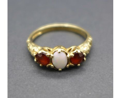 A 9ct gold, opal and garnet ring, 2.6g, L