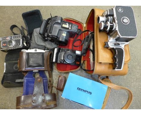 A Bolex Paillard cine camera, an Agfa Isolette II camera, a Kodak instamatic camera and three other cameras