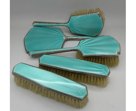 A silver and enamel mirror and four brushes, a/f