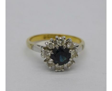 An 18ct gold, sapphire and diamond cluster ring, 3.5g, K