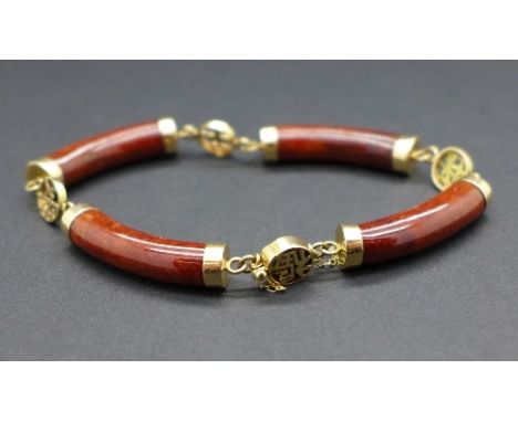 A 14ct gold and jade bracelet