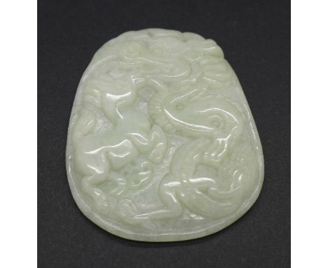 A Chinese carved jade pendant with dragon and rabbit, 4cm x 3cm