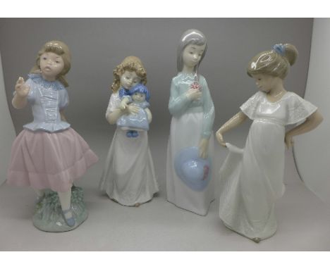 Four Nao figures, height of tallest 23cm