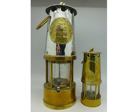 An Eccles Type 6 miners lamp and a miniature brass miners lamp