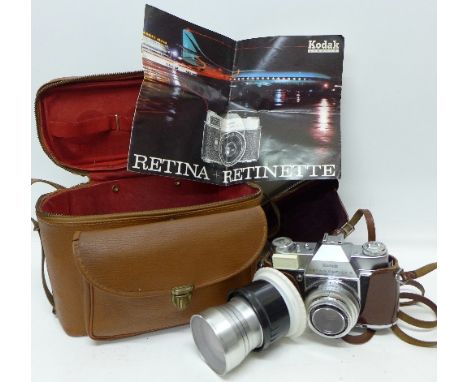 A Kodak Retina Reflex S camera, cased, with carrying case and two lenses