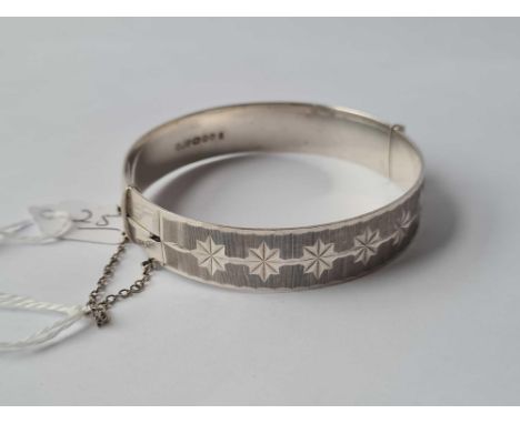 A solid silver bangle with star decoration 30g