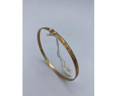 A pritty engraved bangle 9ct - 5.9 gms 