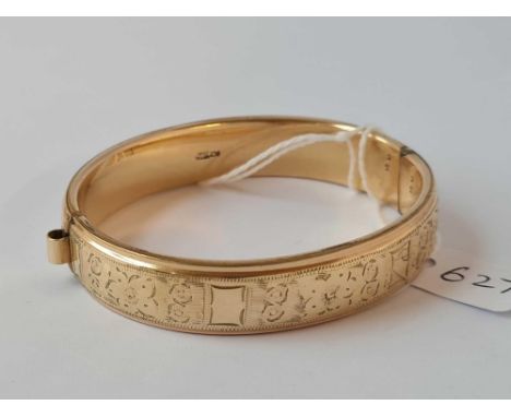 A rolled gold bangle  
