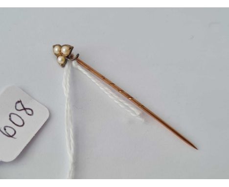 A leaf shaped three pearl terminal toped stick pin 15ct gold 