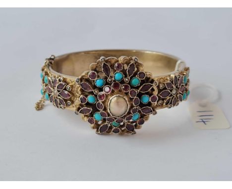 A antique austro Hungarian bangle set with turquoise garnets and pearls 