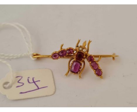 A RUBY SET BUG BROOCH 22CT GOLD 