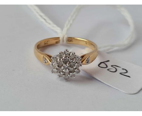 A multi diamond cluster ring in 18ct gold size K 3.1g inc